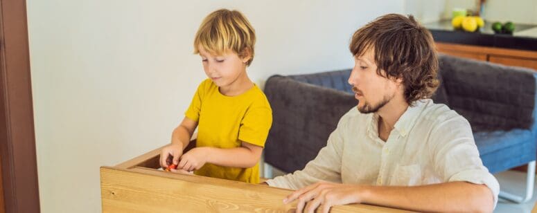 a father and son build a table after downsizing your home with kids