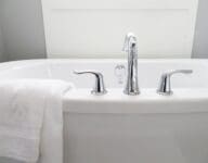 A bathtub in a home that has been staged.