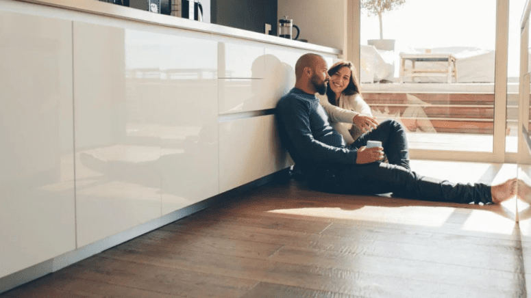 Couple enjoying increase value of new flooring in their home.