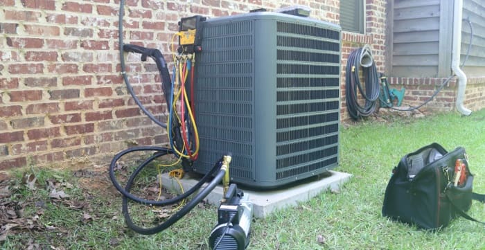 An air conditioner that is maintained outside of a home.