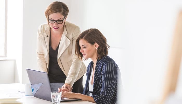 Woman marketing her home repair insurance to a buyer.