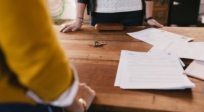 An agent at a home sale meeting before the moving process.