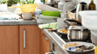 A messy kitchen in a house that needs to be deodorized.