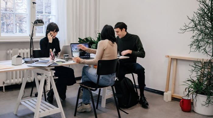 Business people working at a real estate investment trust company.