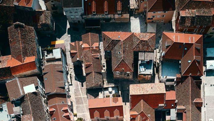 An aerial view of roofs in need of update to increase home value.