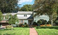 Split-level landscaping in front of home with curb appeal.