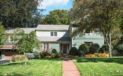 Split-level landscaping in front of home with curb appeal.