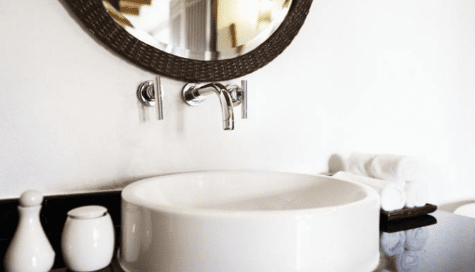 A white sink in clean bathroom in preparation for home appraisal.