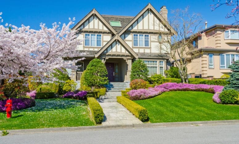 house with curb appeal has fresh landscaping and pops of color