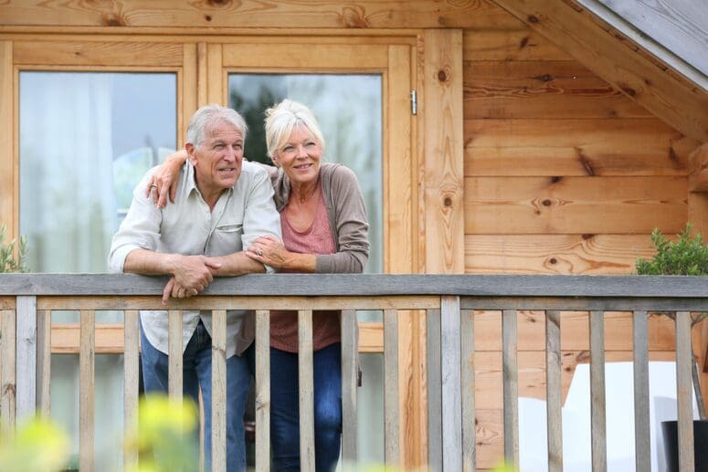 A couple enjoying a balcony after downsizing in retirement.