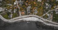 A aerial shot of houses for sale with road noise.