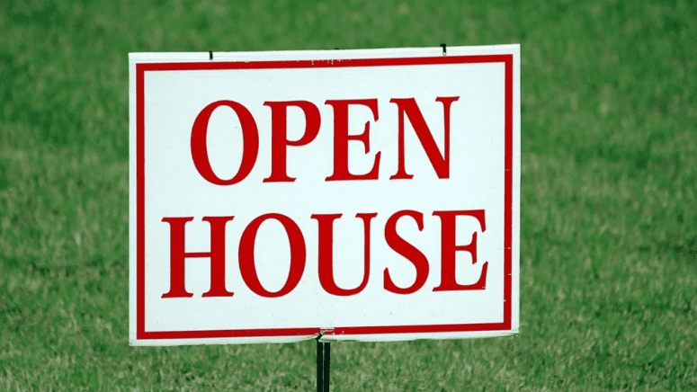 An open house sign as part of how to prepare for an open house