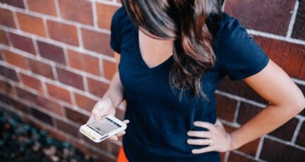 a person selling a house to a millennial on a phone.