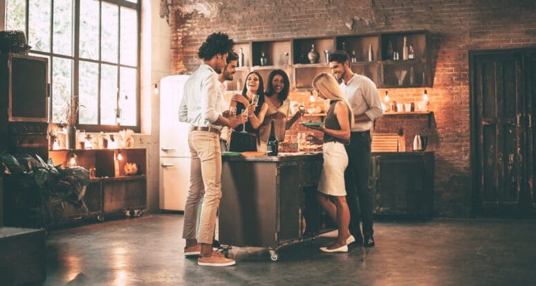 People celebrating a housewarming party with proper etiquette.