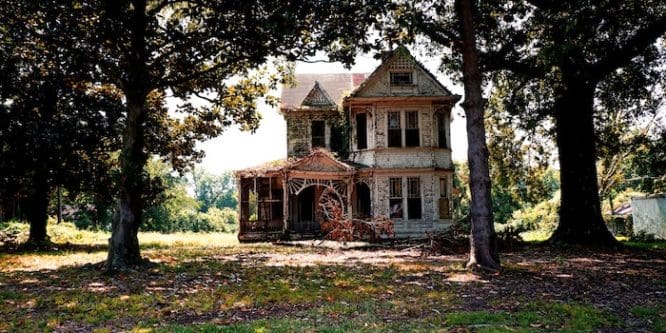 An older home with trees in the yard