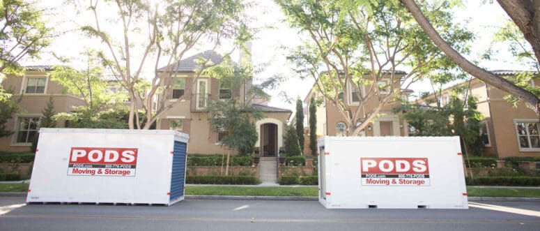 Moving pods in front of a house.