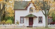 A single family home with a white picket fence