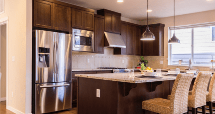 A kitchen with stainless steel appliances in it.