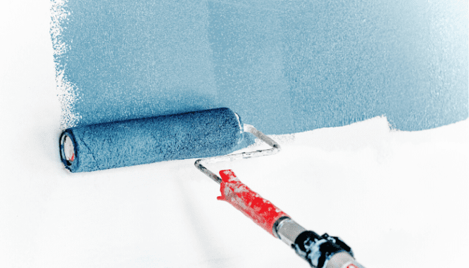 A roller painting a wall.