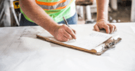 An inspector checking a home for things that would fail a home inspection.