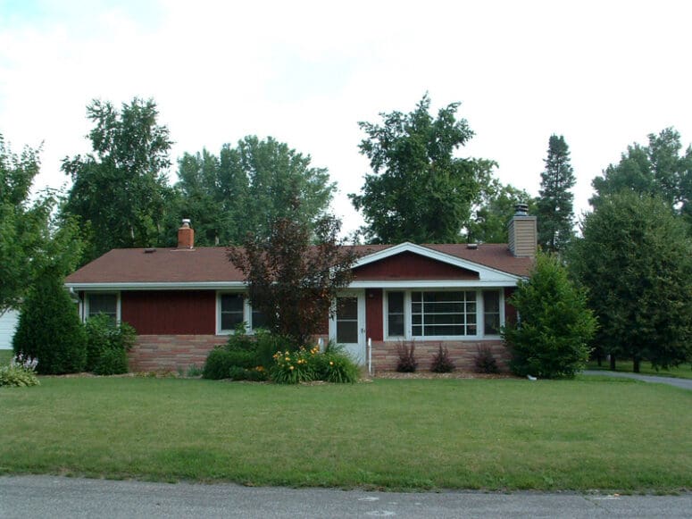 A house with a pergola used to increase curb appeal.