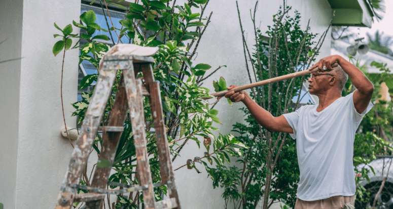 A man doing maintenance on his home.