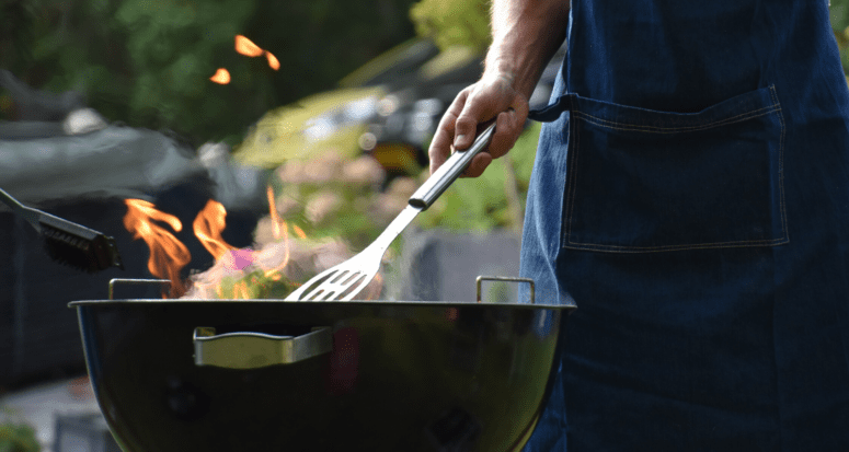 A person grilling while setting boundaries in real estate.