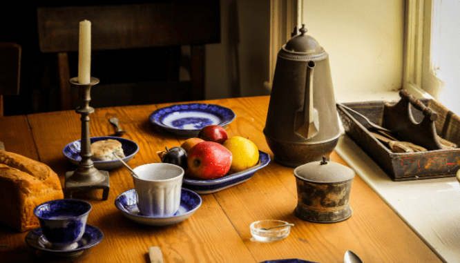 A dining room table set for staging a country home.