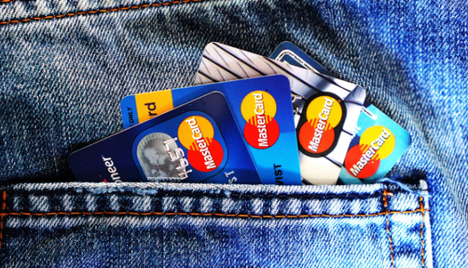 A row of credit cards in a back jeans pocket.