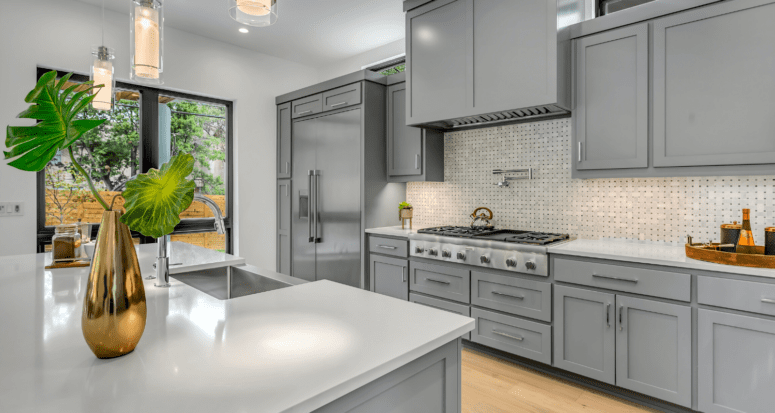 A gray kitchen that you could put new appliances in before selling.