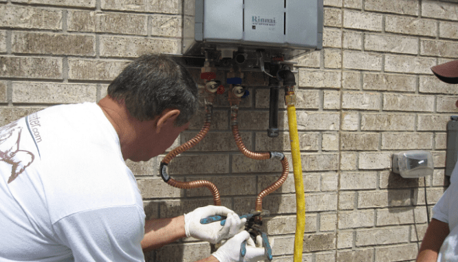 A tankless water heater being installed.