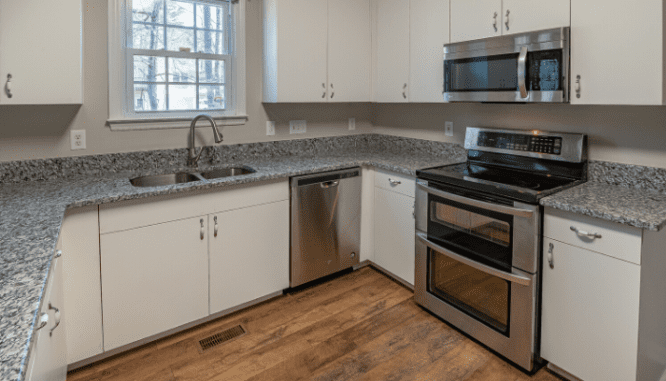 A kitchen with a new marble countertop, a way you could increase your home value.