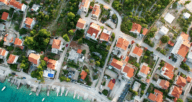 An aerial view of houses you can buy using a real estate agent.