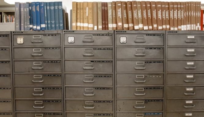 A file cabinet of records to show the title research portion of the short sale buying process