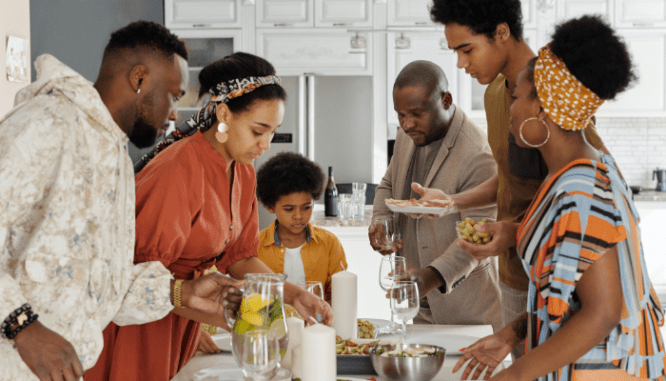 A family having a housewarming party as a way of getting settled in their new home.