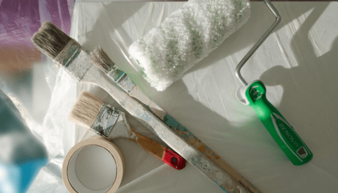 A paintbrush used in a diy bathroom remodel.