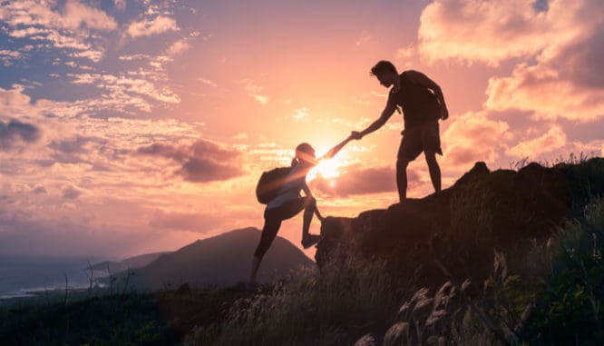 people helping each other hike up a mountain symbolizes a helping hand for buyers to get rid of pmi