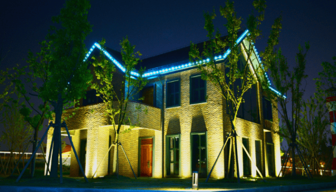 A photo of a house bathed in light.