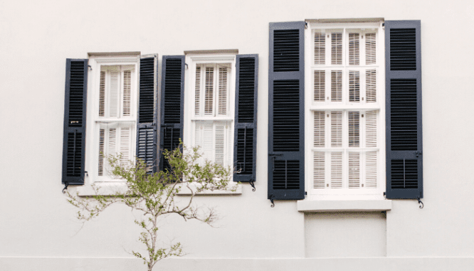 A photo of shutters on the front of a house.