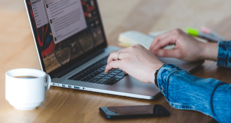 A woman using a computer to get preapproved for a mortgage.