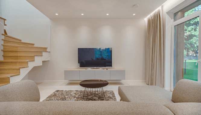 A living room showing balance, a way of optimizing furniture arrangement in a new house.