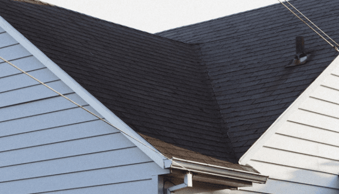 A photo of a roof illustrates the topic of common repairs needed after a home inspection.