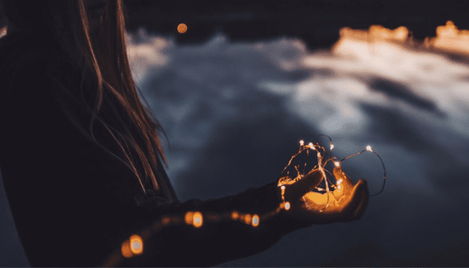 Fairy lights used to increase farmhouse curb appeal.