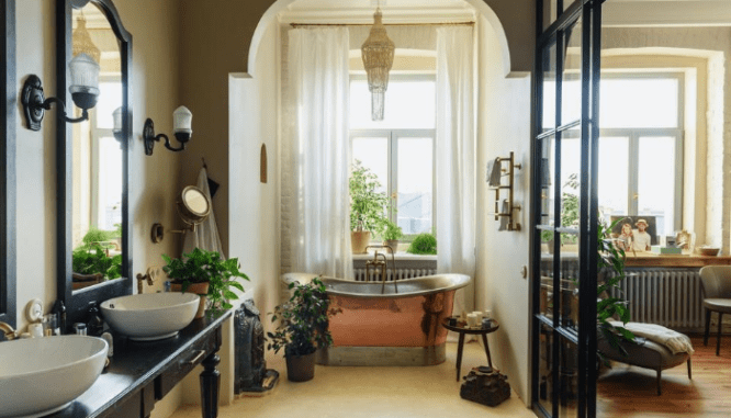 A copper tub in an open concept bathroom.