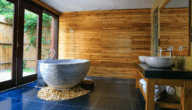 An open concept bathroom with a tub.