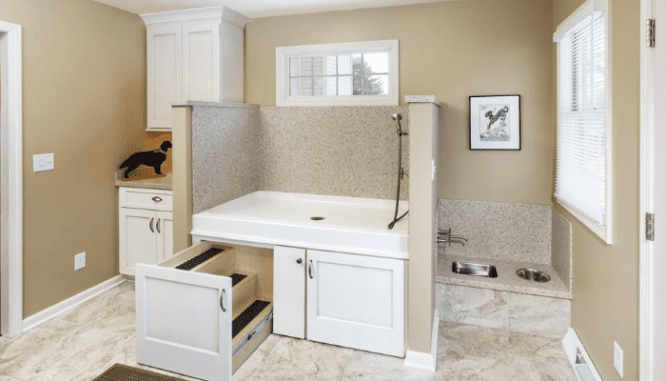 A dog bath in a room addition in a small home.