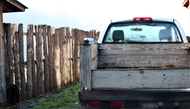 A truck used to remove a hot tub from a house.