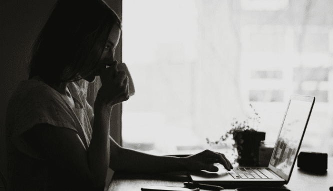 A woman researching how to sell a house.