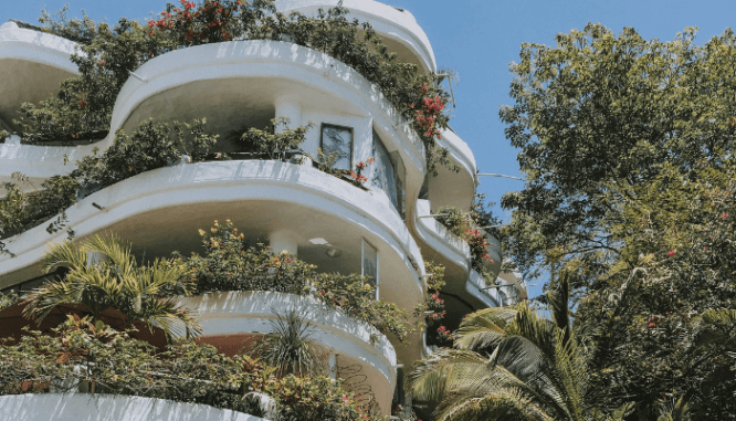 Several condo balconies with lush gardens, a house you could be making an offer on.