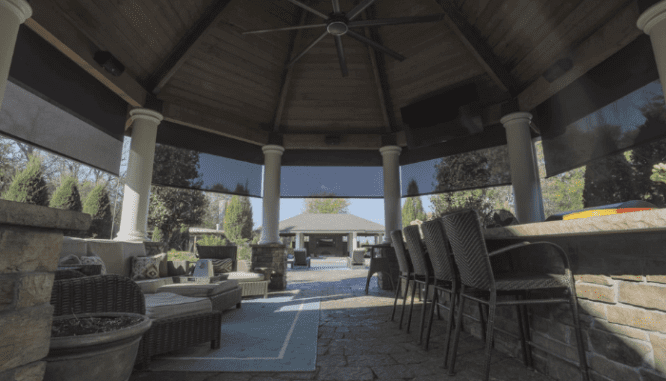 A gazebo in a backyard patio.